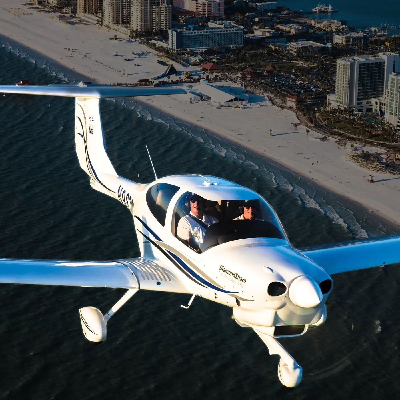 Discovery flight: a student pilot and instructor flying a small plane over the coast