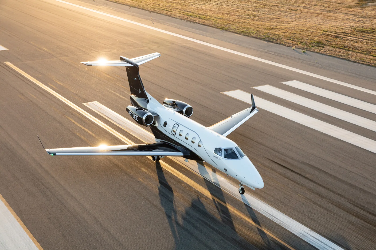 Embraer Phenom private jet on the runway, available as an empty leg