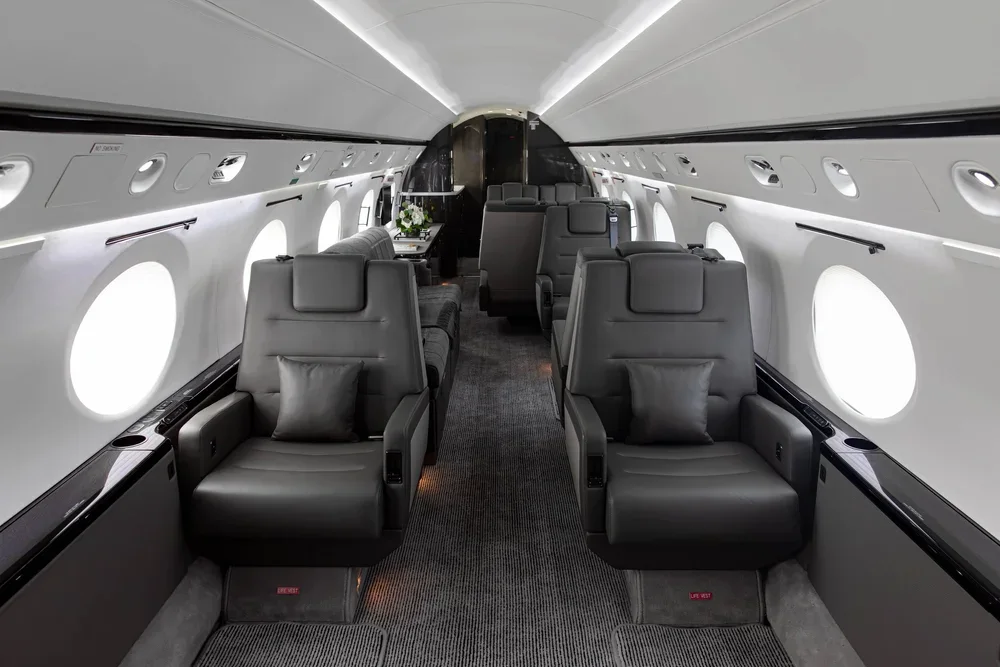 Private jet cabin with leather seats for a shared flight